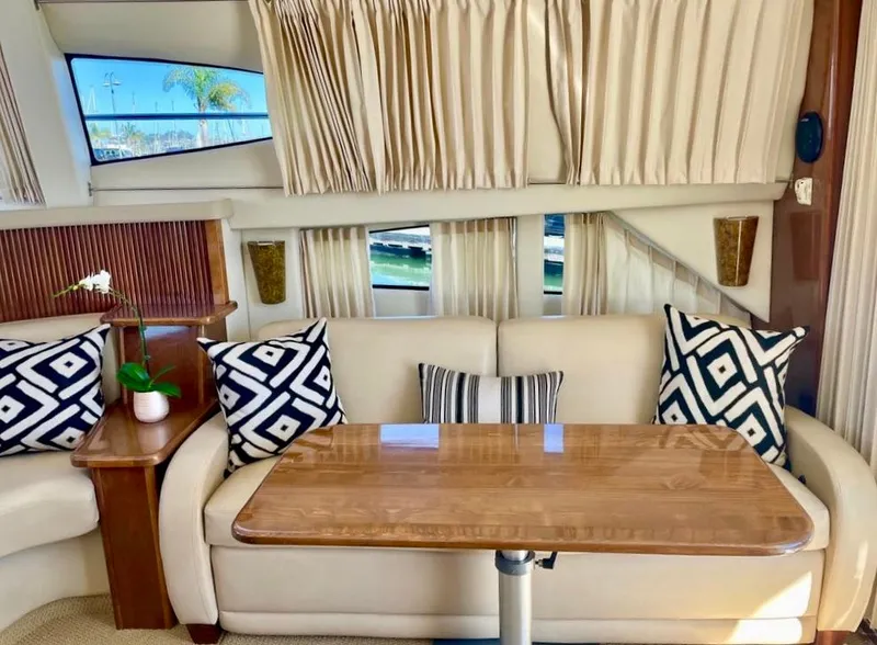 Slide: The Image of Interior of 2007 Carver 35 Super Sport yacht with elegant seating and wooden table. - 19