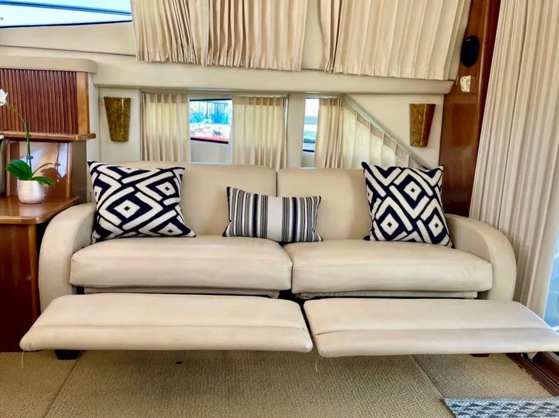 Slide: The Image of Luxurious interior of 2007 Carver 35 Super Sport yacht with plush sofa and decorative pillows. - 21