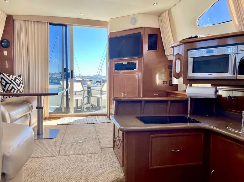 Slide: The Image of Interior of 2007 Carver 35 Super Sport yacht with kitchen and seating area. - 28