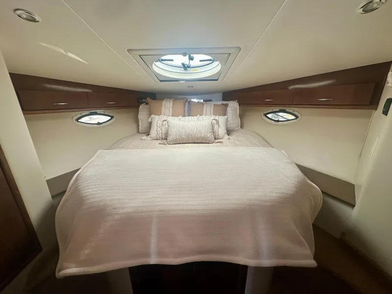 Slide: The Image of Luxurious cabin interior of 2007 Carver 35 Super Sport yacht with elegant bedding. - 30