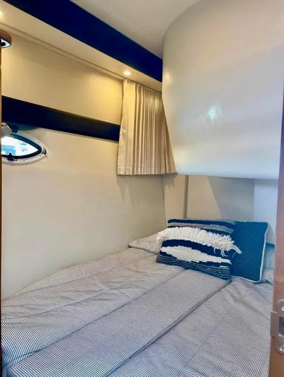 Slide: The Image of 2007 Carver 35 Super Sport cabin with cozy bed and modern decor. - 32