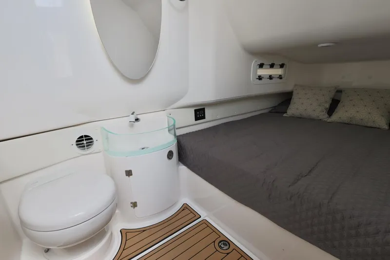 Slide: The Image of 2020 Fountain 39 NX cabin interior with bed, sink, and toilet. - 13