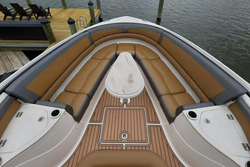 Slide: The Image of 2020 Fountain 39 NX boat interior with tan seating and teak flooring. - 4