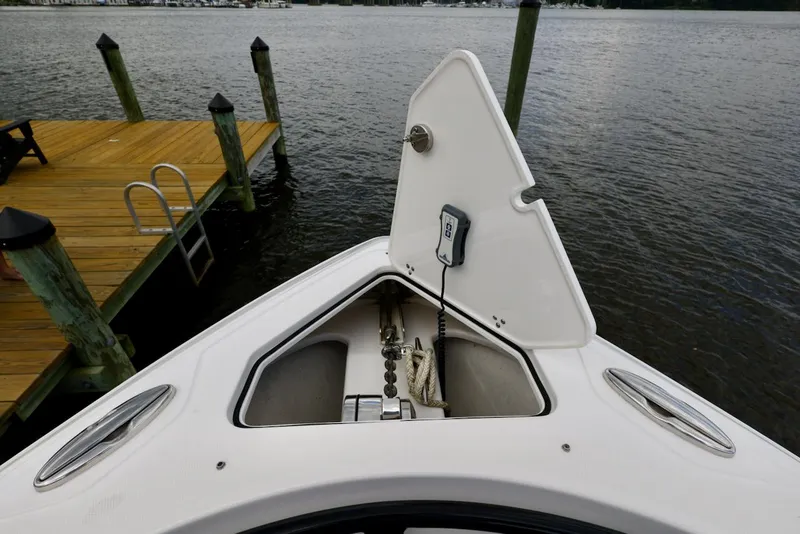 Slide: The Image of Fountain 39 NX 2020 boat bow with open anchor locker near dock. - 9