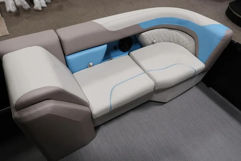 Slide: The Image of 2025 Sweetwater SW 2286 QS boat seating with blue and gray upholstery. - 14