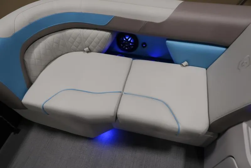 Slide: The Image of Sweetwater SW 2286 QS 2025 boat interior with cushioned seating and ambient lighting. - 17