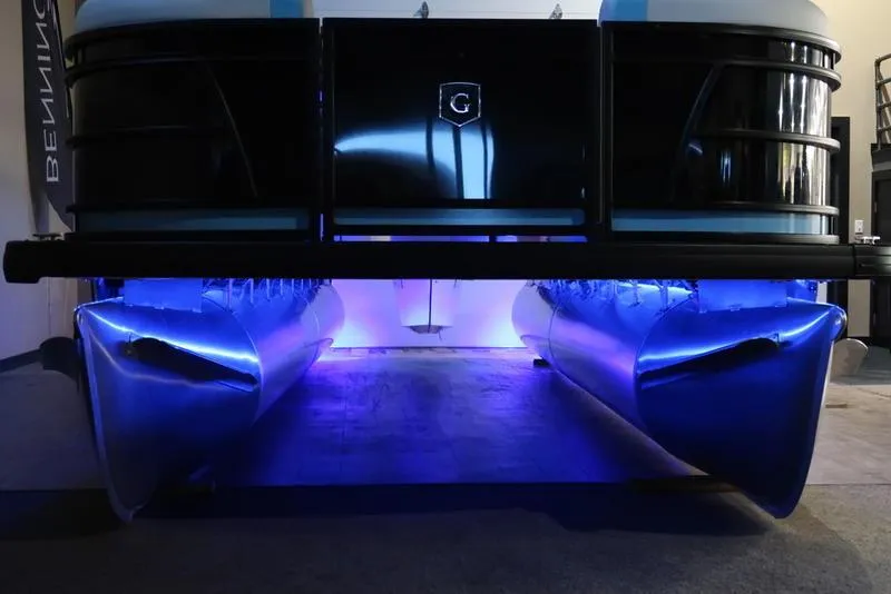 Slide: The Image of 2025 Sweetwater SW 2286 QS pontoon boat with blue LED underglow lighting. - 27