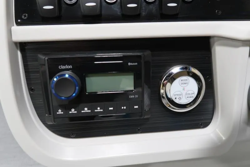 Slide: The Image of Sweetwater SW 2286 QS 2025 dashboard with Clarion audio system and control panel. - 34