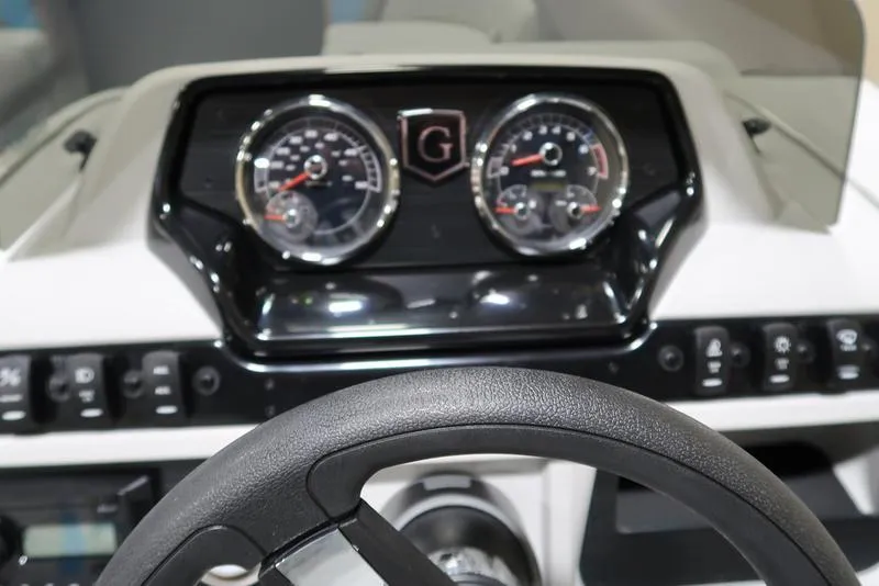 Slide: The Image of Dashboard of 2025 Sweetwater SW 2286 QS boat with steering wheel and gauges. - 35