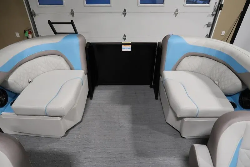 Slide: The Image of 2025 Sweetwater SW 2286 QS boat interior with blue and white seating. - 39