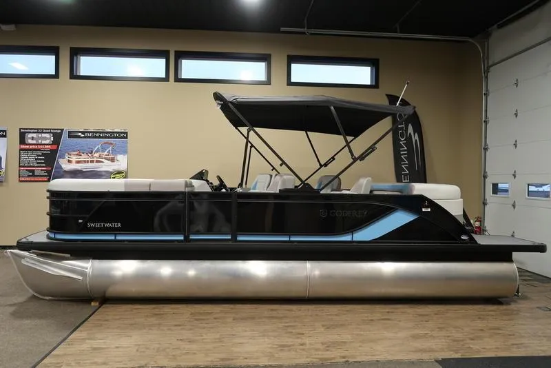 Slide: The Image of 2025 Sweetwater SW 2286 QS pontoon boat in showroom display. - 4