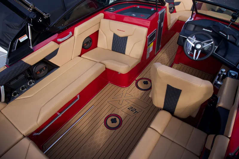 Slide: The Image of Luxurious interior of 2025 MasterCraft XT22T boat with tan and red seating. - 8