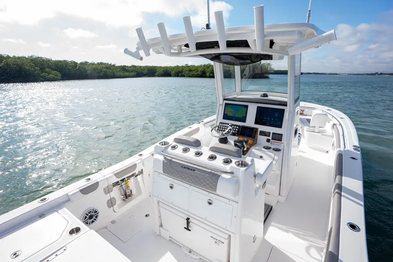 Slide: The Image of 2025 Caymas 291 boat on water, featuring modern helm and spacious deck. - 22