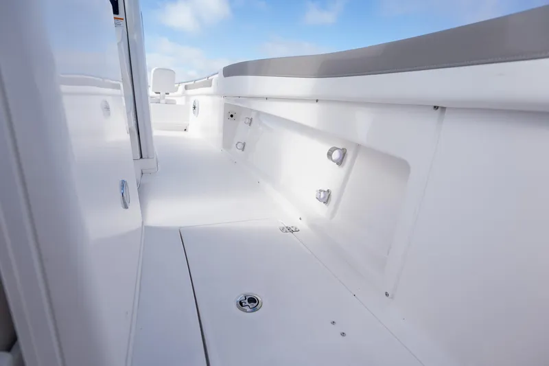 Slide: The Image of 2025 Caymas 291 boat interior with sleek white deck and modern design. - 26