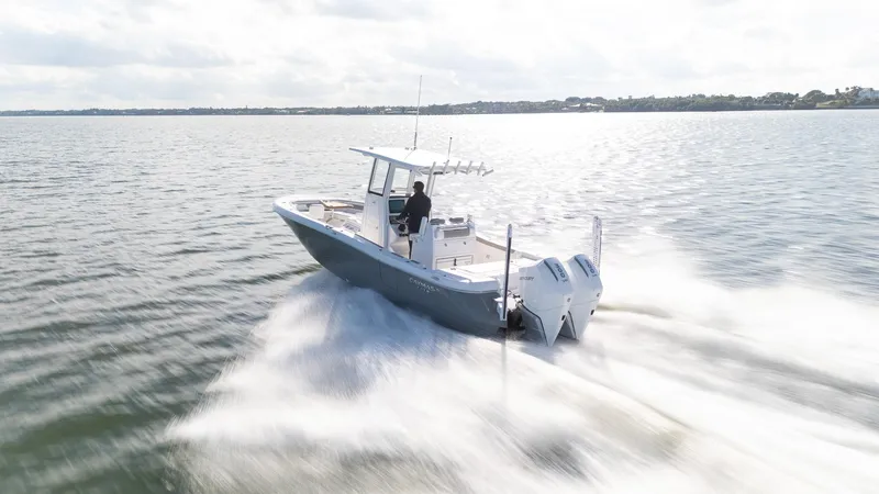 Slide: The Image of 2025 Caymas 291 boat speeding on open water. - 6