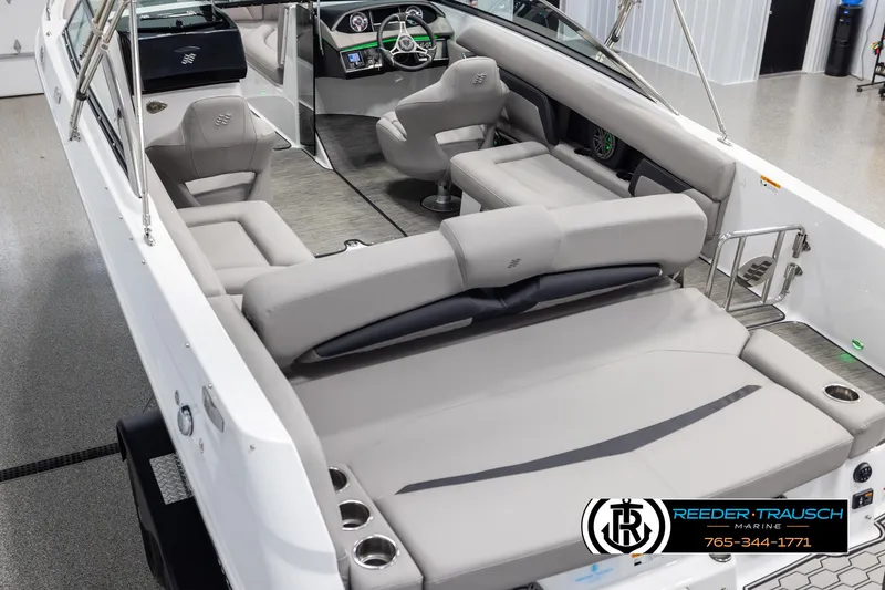 Slide: The Image of 2025 Four Winns HD5 boat interior with gray seating and modern dashboard. - 11