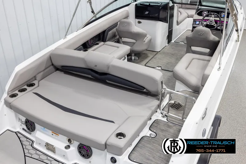 Slide: The Image of 2025 Four Winns HD5 boat interior with gray seating and modern dashboard. - 12