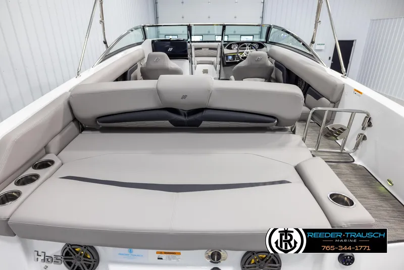Slide: The Image of 2025 Four Winns HD5 boat interior with spacious seating and modern design. - 13