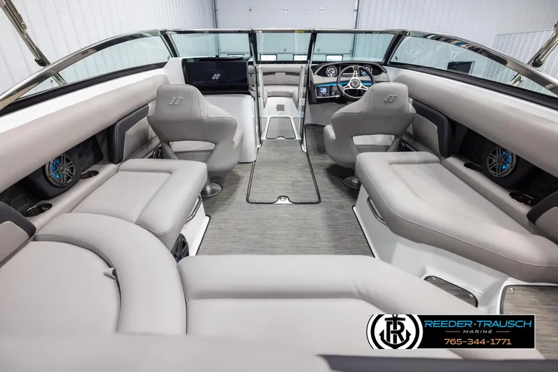 Slide: The Image of 2025 Four Winns HD5 boat interior with luxurious seating and modern dashboard. - 14