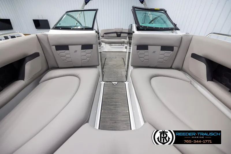 Slide: The Image of 2025 Four Winns HD5 boat interior with luxurious seating and modern design. - 17