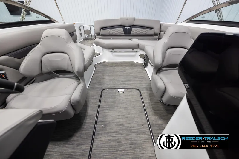 Slide: The Image of Interior of 2025 Four Winns HD5 boat with gray seating and modern design. - 18