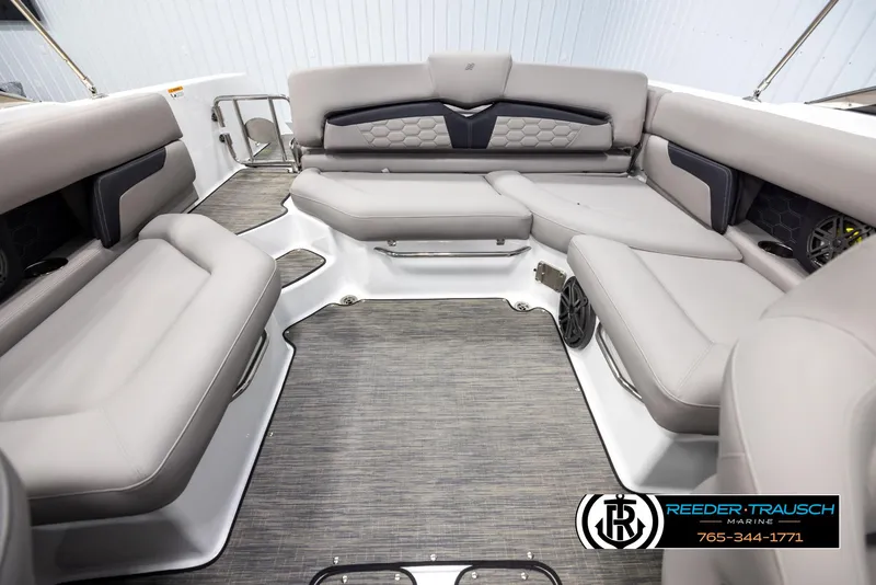 Slide: The Image of 2025 Four Winns HD5 boat interior with luxurious gray seating and modern design. - 19