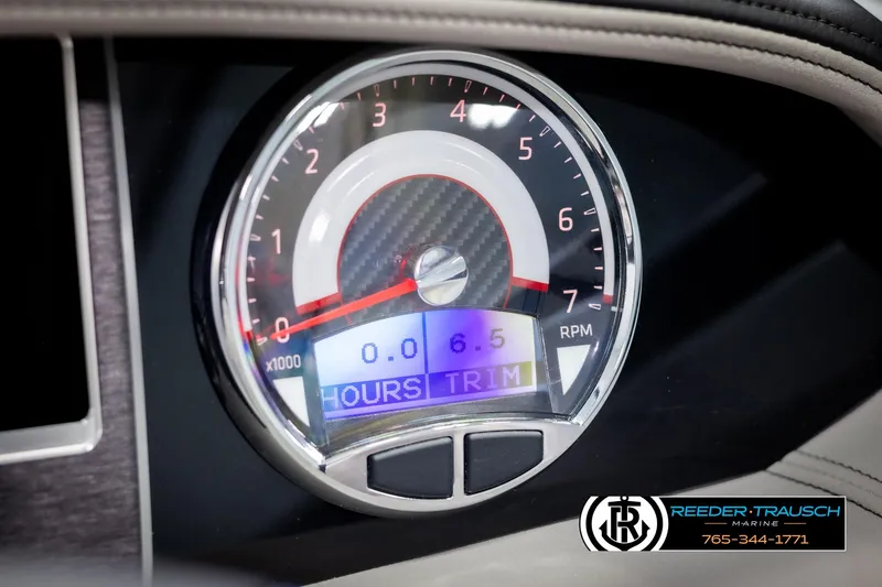 Slide: The Image of 2025 Four Winns HD5 dashboard tachometer displaying RPM and trim settings. - 40