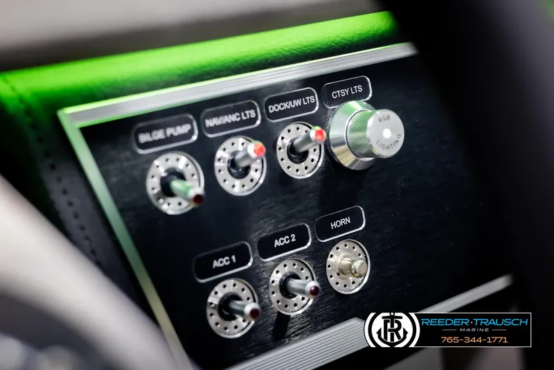 Slide: The Image of Control panel of 2025 Four Winns HD5 boat with switches and RGB lighting knob. - 41