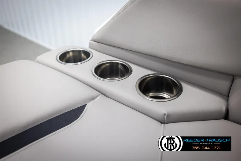 Slide: The Image of 2025 Four Winns HD5 boat interior with three stainless steel cup holders. - 46