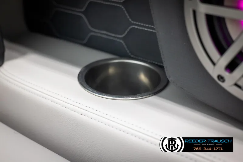 Slide: The Image of Cup holder and speaker detail in 2025 Four Winns HD5 boat interior. - 48