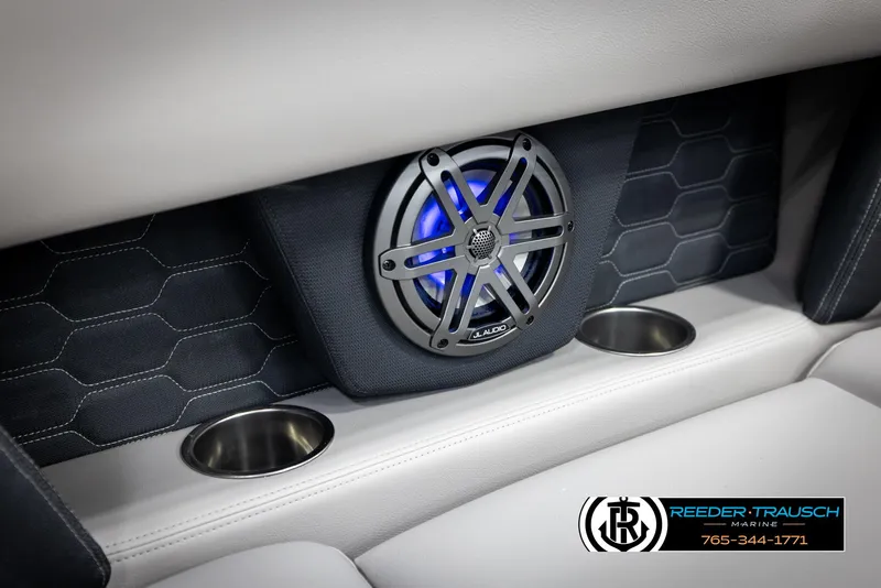 Slide: The Image of 2025 Four Winns HD5 boat interior with JL Audio speaker and cup holders. - 49