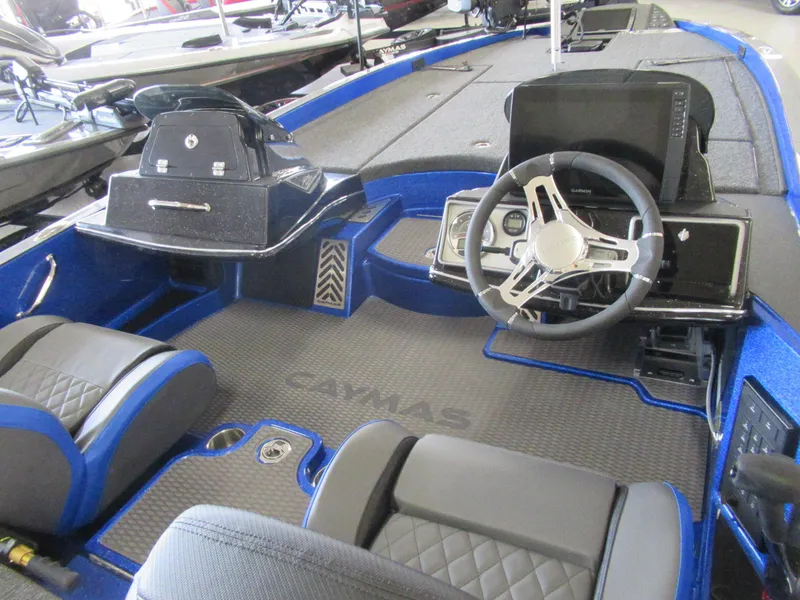 Slide: The Image of 2025 Caymas CX 21 PRO boat interior with modern steering and seating. - 2