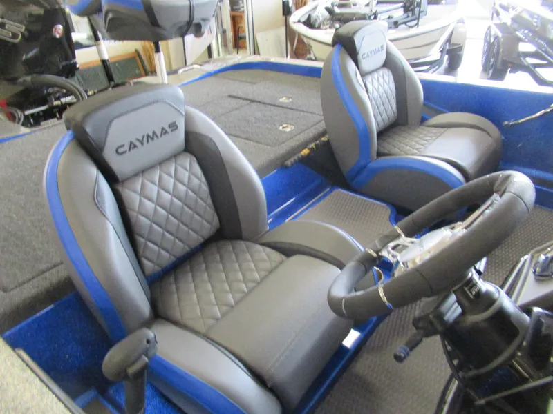 Slide: The Image of 2025 Caymas CX 21 PRO boat interior with gray and blue seating. - 3