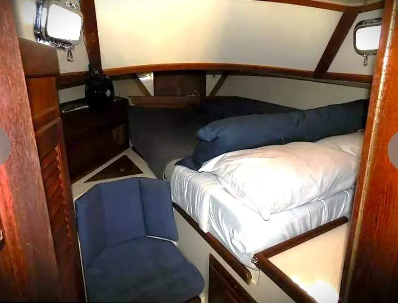 Slide: The Image of Cozy cabin interior of 1995 Pacific Seacraft 37 sailboat with bed and seating. - 3