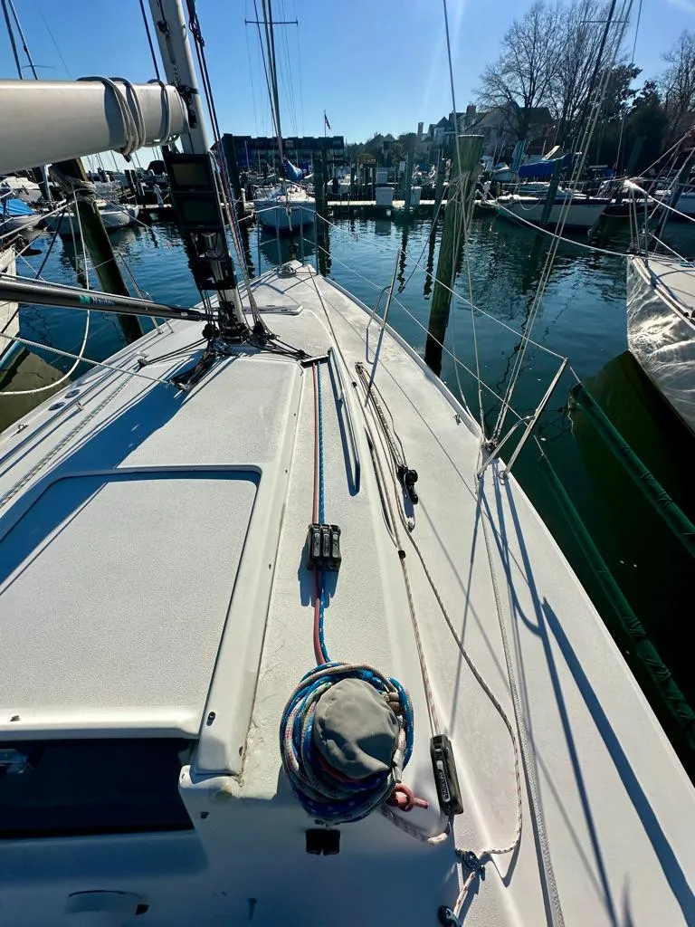 Slide: The Image of 2006 J Boats J/92S sailboat docked in a marina, sunny day. - 17