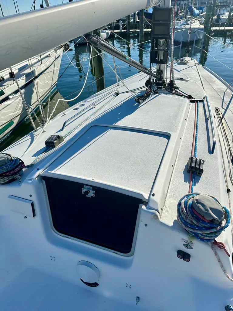 Slide: The Image of 2006 J Boats J/92S sailboat deck with rigging and marina background. - 26