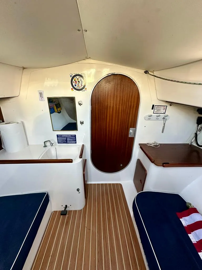 Slide: The Image of Interior of 2006 J Boats J/92S sailboat with wood accents and seating. - 27