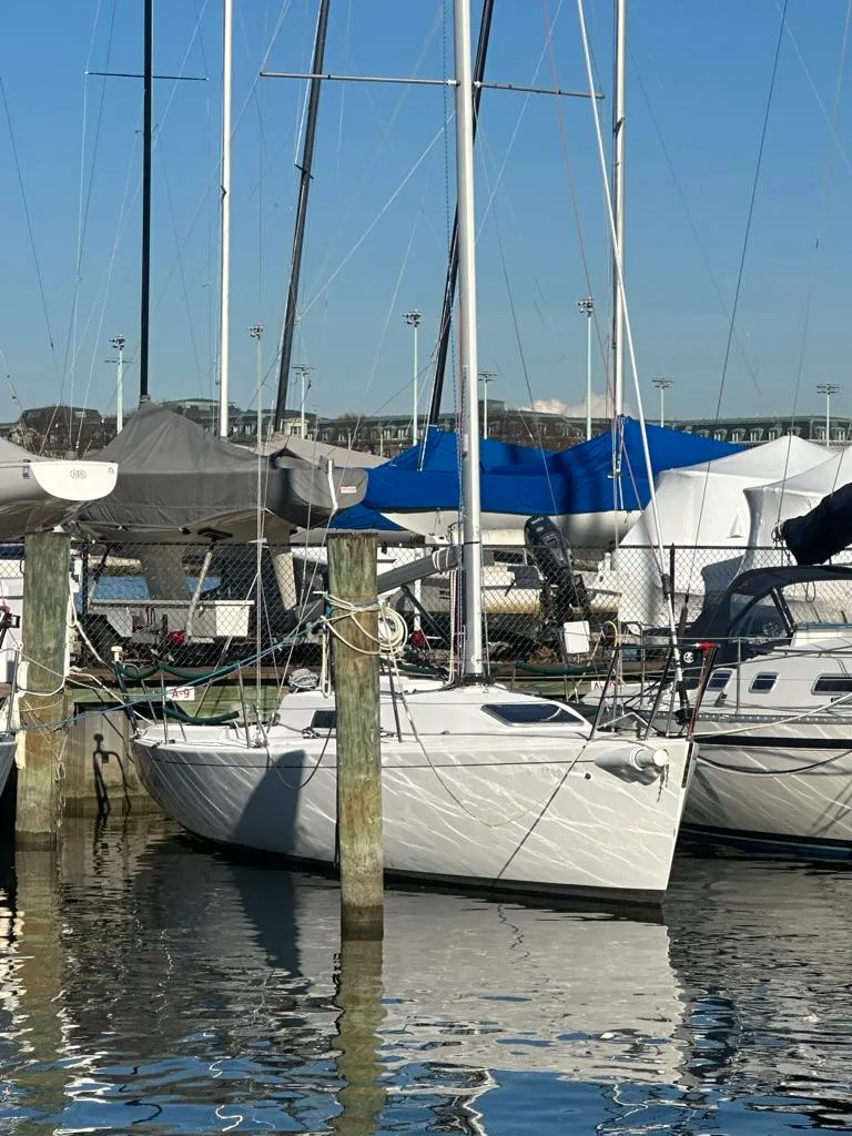 Slide: The Image of 2006 J Boats J/92S sailboat docked in marina under clear blue sky. - 3