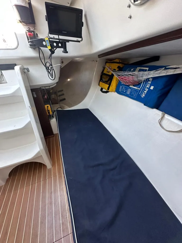 Slide: The Image of Interior of 2006 J Boats J/92S sailboat with navigation equipment and seating area. - 30