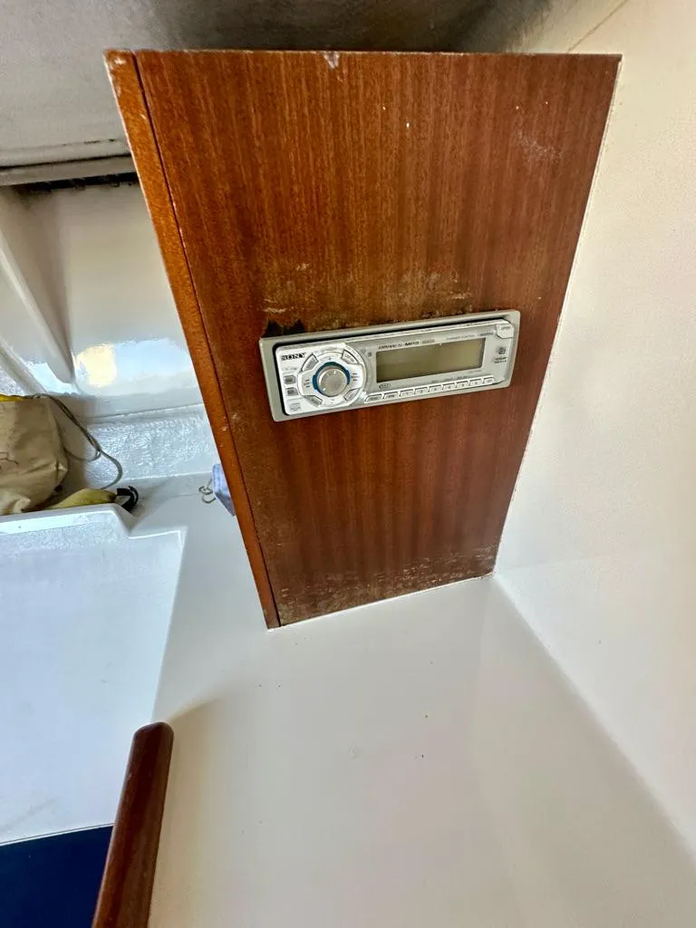 Slide: The Image of Wooden panel with a stereo system on a 2006 J Boats J/92S sailboat. - 31