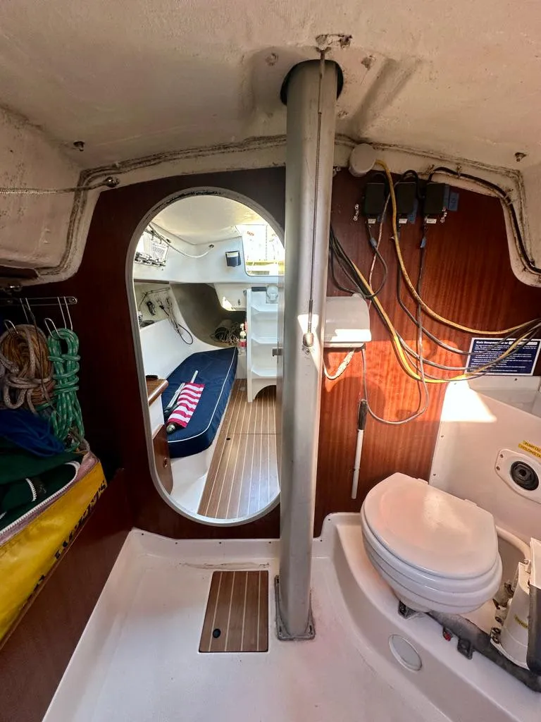 Slide: The Image of Interior of 2006 J Boats J/92S sailboat, featuring cabin and nautical equipment. - 33