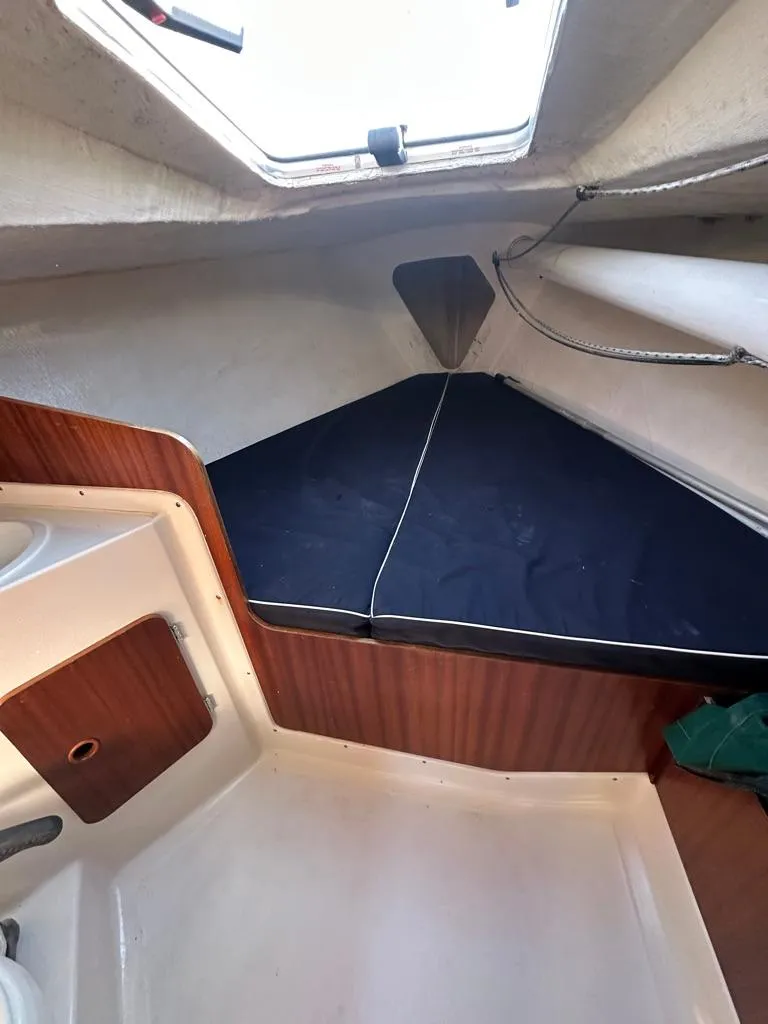 Slide: The Image of Interior cabin of 2006 J Boats J/92S sailboat with V-berth and wooden accents. - 34
