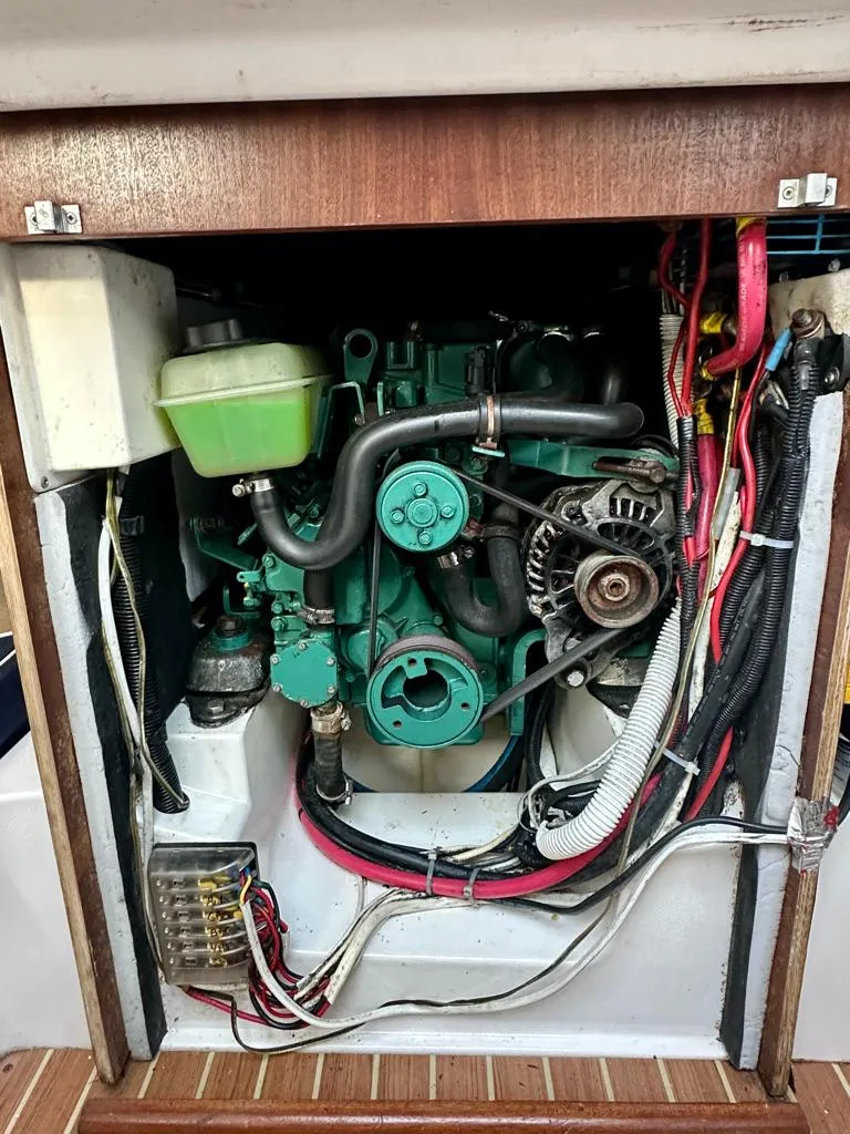 Slide: The Image of 2006 J Boats J/92S engine compartment with visible wiring and components. - 37