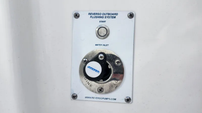 Slide: The Image of Reverso outboard flushing system on 2023 Edgewater 280 CX boat. - 19