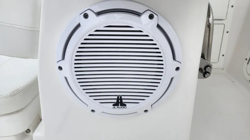 Slide: The Image of JL Audio speaker on 2023 Edgewater 280 CX boat interior. - 34