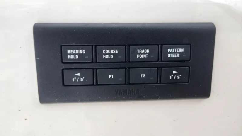 Slide: The Image of Control panel of 2023 Edgewater 280 CX boat with navigation buttons. - 43