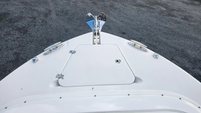 Slide: The Image of Bow of 2023 Edgewater 280 CX boat with anchor and hatch. - 50