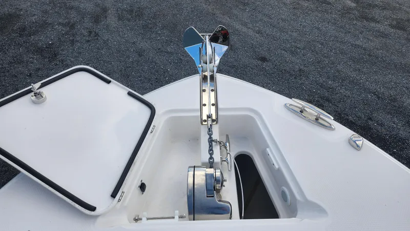 Slide: The Image of Edgewater 280 CX 2023 boat anchor system with open hatch on deck. - 51