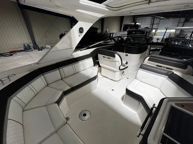 Slide: The Image of Interior of 2016 Sea Ray 310 SLX boat with luxurious seating and modern design. - 10