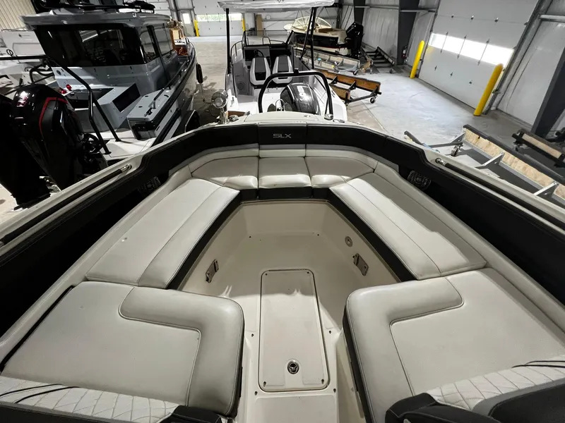 Slide: The Image of Interior view of 2016 Sea Ray 310 SLX boat with spacious seating. - 18